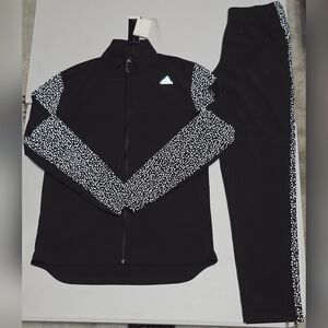 Adidas Supernova Storm jacket and matching pants featuring reflective details